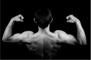 black and white image of a strong man flexing