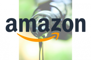 Amazon Logo superimposed over a photo of pouring hemp oil out of a bottle